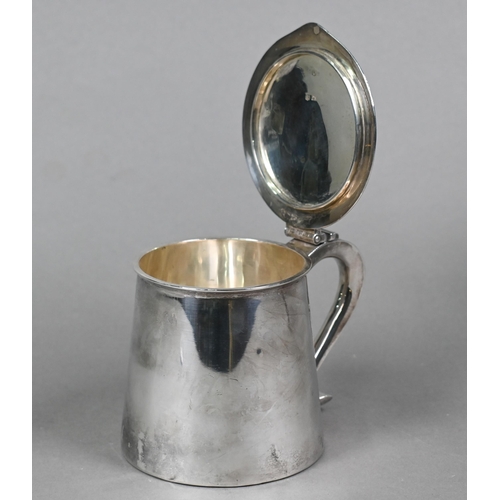 54 - An Edwardian Arts & Crafts silver lidded jug of squat, tapering cylindrical form with flat lid a... 