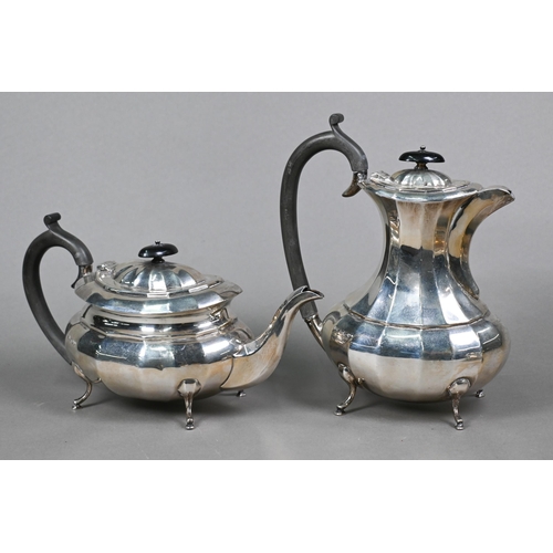 60 - A heavy quality silver four-piece tea service of oval form with vertical facets, on pad feet, with c... 