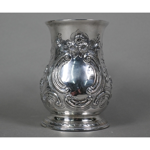 68 - A George III silver baluster mug, later embossed and chased with rococo scrolls and flowers, with sc... 