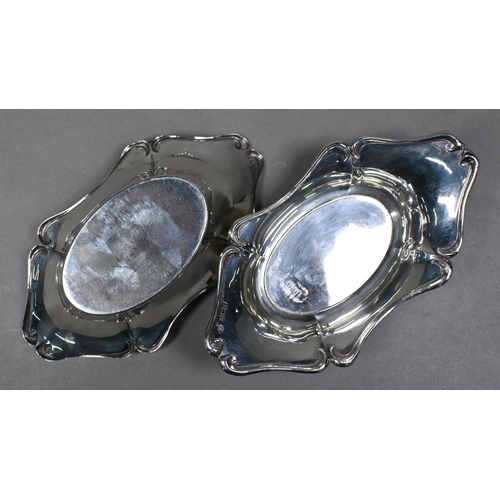 71 - An Edwardian pair of silver bonbon dishes, Birmingham 1908, a small toast rack, Sheffield 1903 and a... 