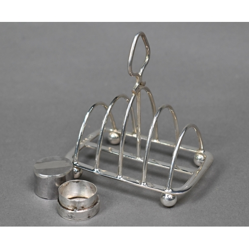 71 - An Edwardian pair of silver bonbon dishes, Birmingham 1908, a small toast rack, Sheffield 1903 and a... 