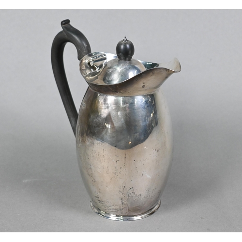 90 - A silver hot water jug of ovoid form with composite handle and finial, Z Barraclough & Sons, She... 