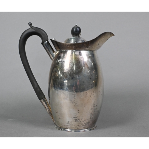 90 - A silver hot water jug of ovoid form with composite handle and finial, Z Barraclough & Sons, She... 