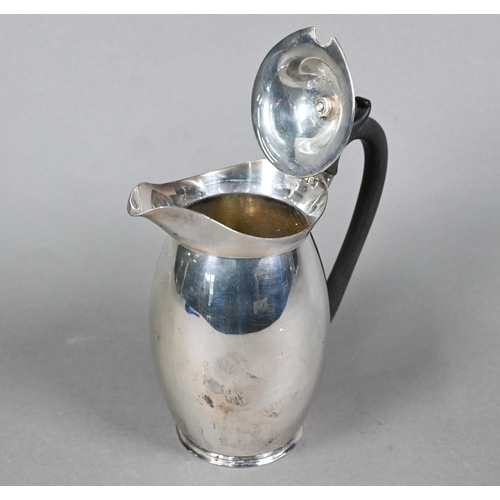 90 - A silver hot water jug of ovoid form with composite handle and finial, Z Barraclough & Sons, She... 
