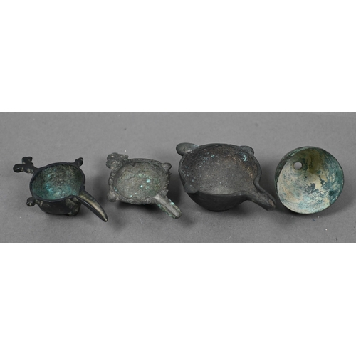 1119 - An collection of assorted antique bronze objects of Luriston origin, including three small crucibles... 