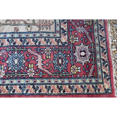 755 - A Turkish Zeigler design pale red and camel ground geometric design carpet, 435 cm x 303 cm, good ev... 