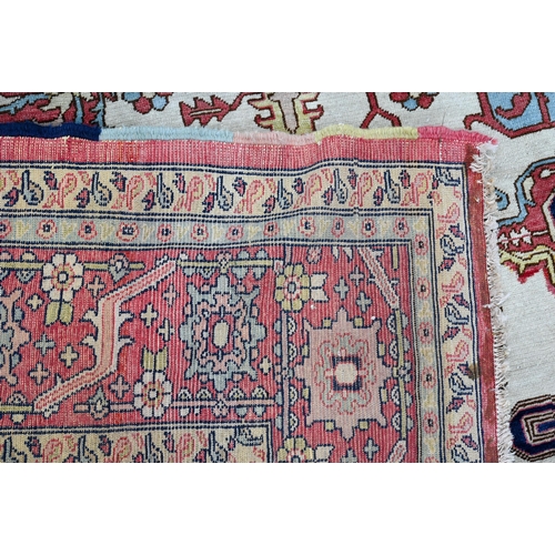 755 - A Turkish Zeigler design pale red and camel ground geometric design carpet, 435 cm x 303 cm, good ev... 