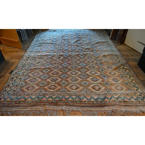 789 - A vintage Turkish carpet, repeating geometric design on pale terracotta ground and kilim finished en... 