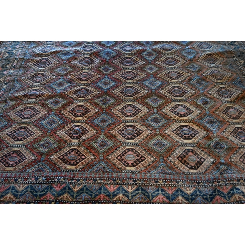 789 - A vintage Turkish carpet, repeating geometric design on pale terracotta ground and kilim finished en... 