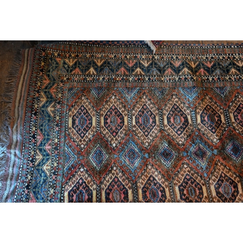 789 - A vintage Turkish carpet, repeating geometric design on pale terracotta ground and kilim finished en... 