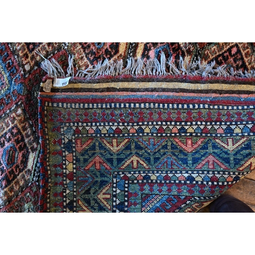 789 - A vintage Turkish carpet, repeating geometric design on pale terracotta ground and kilim finished en... 