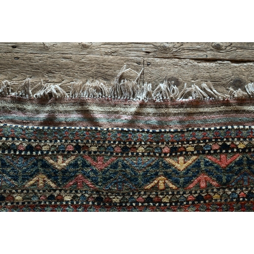 789 - A vintage Turkish carpet, repeating geometric design on pale terracotta ground and kilim finished en... 
