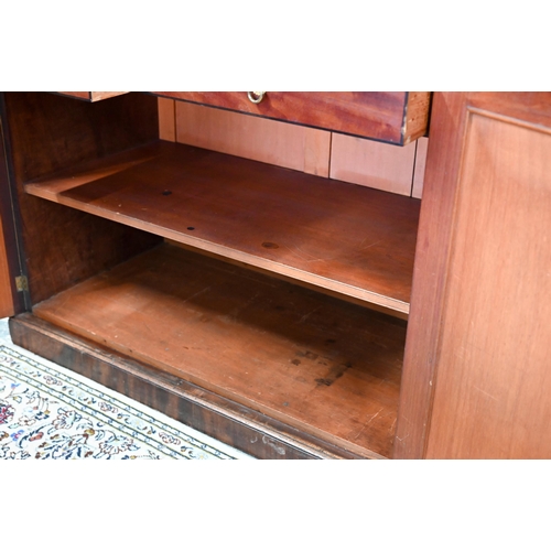 862 - A Regency flame mahogany library bookcase in the manner of Gillows, the moulded cornice over four go... 