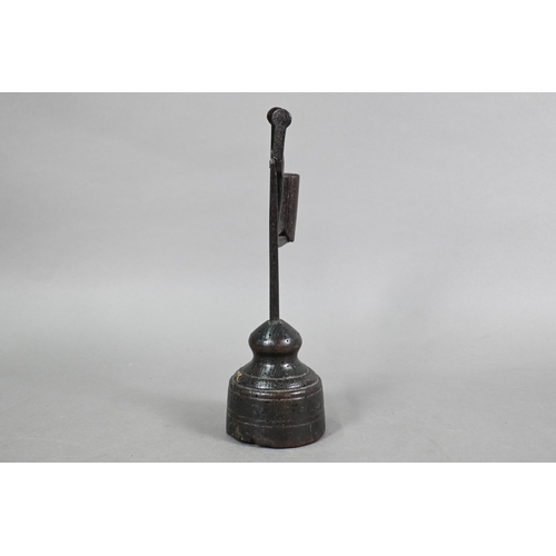 809 - An 18th century wrought iron pivoting rush light holder, raised on a wood block base, 28 cm h, evide... 