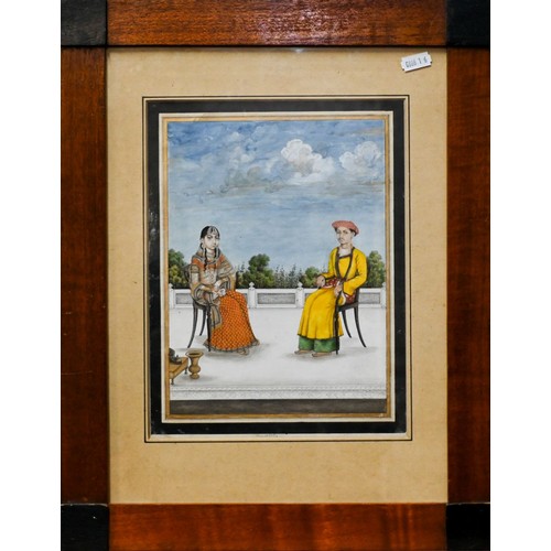 747 - A fine Indian Mughal School watercolour, 19th century, depicting a royal couple seated on a terrace ... 