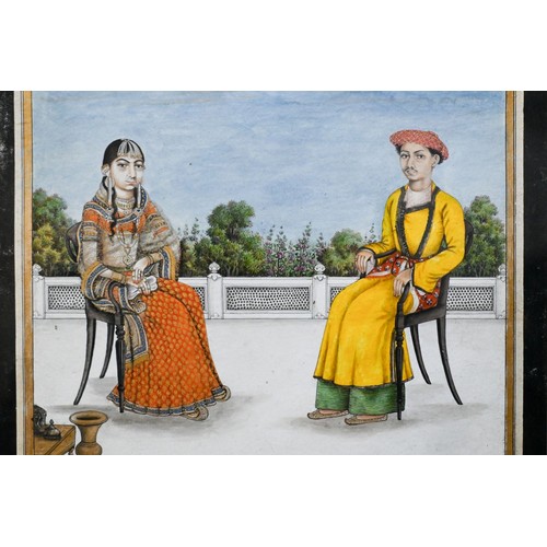 747 - A fine Indian Mughal School watercolour, 19th century, depicting a royal couple seated on a terrace ... 