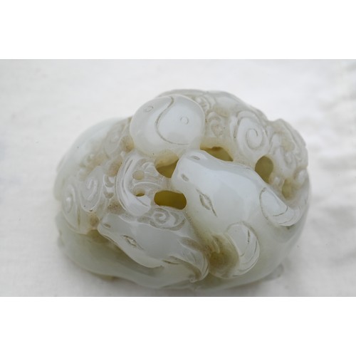 383 - An 18th century Chinese jade carving of three rams, sanyang, with swirling clouds and a yinyang symb... 