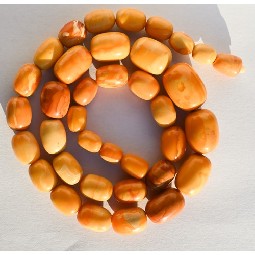 245 - A row of butterscotch amber beads on screw clasp, a/f, approx 30g