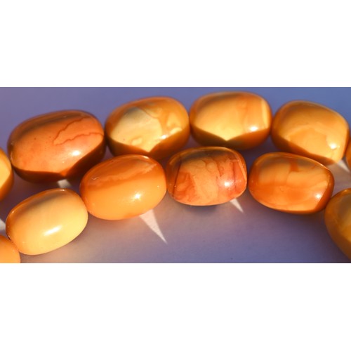 245 - A row of butterscotch amber beads on screw clasp, a/f, approx 30g