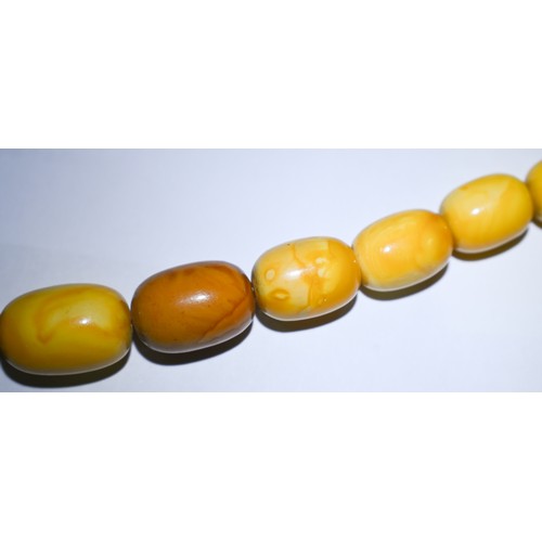 245 - A row of butterscotch amber beads on screw clasp, a/f, approx 30g