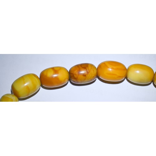 245 - A row of butterscotch amber beads on screw clasp, a/f, approx 30g