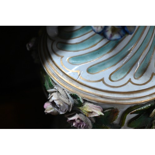 489 - A pair of 19th century Meissen garniture vases, with floral-encrusted covers above twin putti handle... 