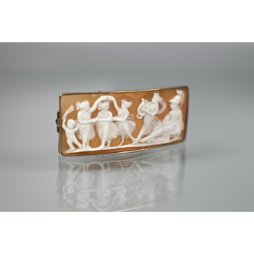 166 - A shell cameo rectangular brooch featuring a classical frieze of figures dancing to harp player, pla... 