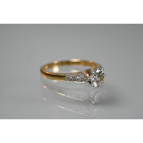 195 - A diamond ring, the central round brilliant cut diamond of approx 0.5 carats with millgrain diamond ... 