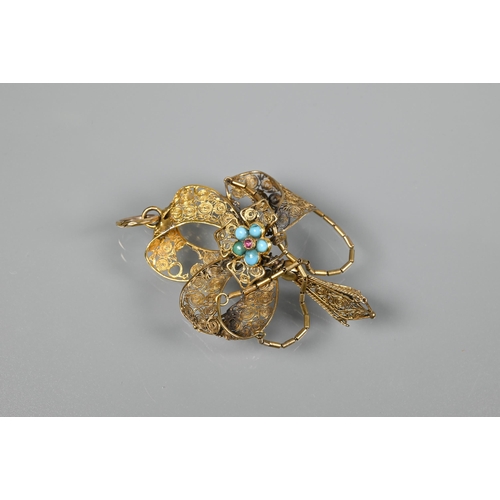 225 - An antique yellow metal filigree pendant, with central turquoise and garnet set cluster, a/f