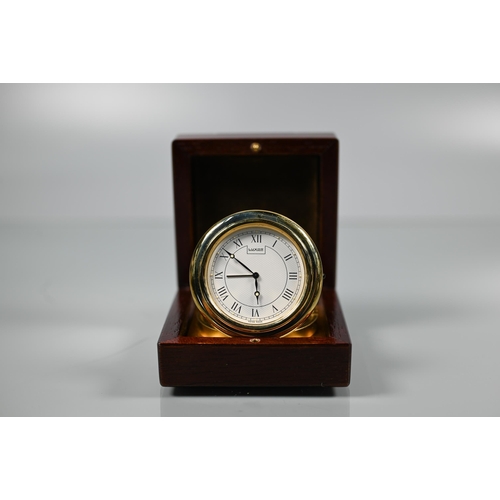 336 - A Swiss Luxor world time travel clock, model 2005, within a leather travel case, c/w warranty card a... 