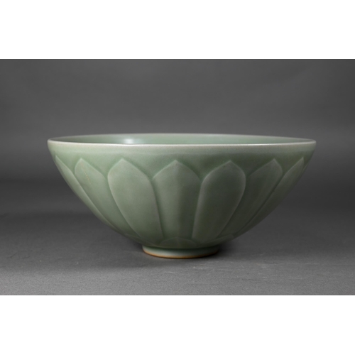 352 - A Chinese longquan celadon 'lotus' bowl with opaque green glaze covering the foliate incise interior... 