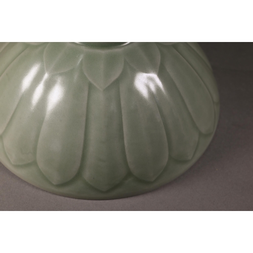 352 - A Chinese longquan celadon 'lotus' bowl with opaque green glaze covering the foliate incise interior... 