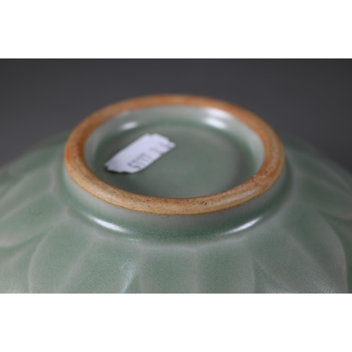 352 - A Chinese longquan celadon 'lotus' bowl with opaque green glaze covering the foliate incise interior... 