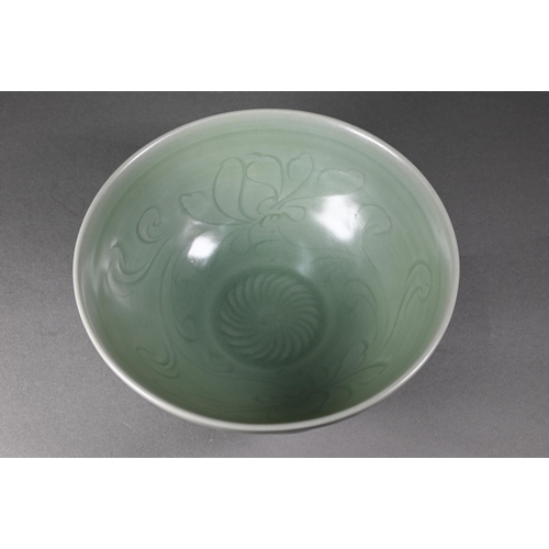 352 - A Chinese longquan celadon 'lotus' bowl with opaque green glaze covering the foliate incise interior... 