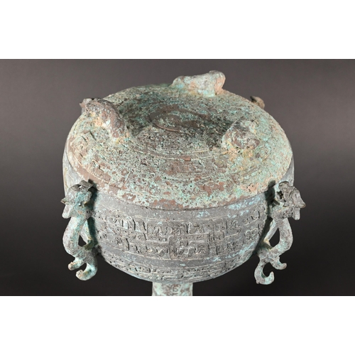 356 - A Chinese bronze ritual food vessel and cover in the Warring States style, Dou, the bowl has four ca... 