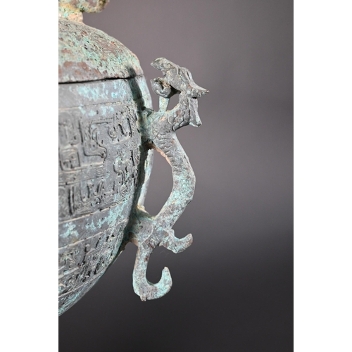 356 - A Chinese bronze ritual food vessel and cover in the Warring States style, Dou, the bowl has four ca... 