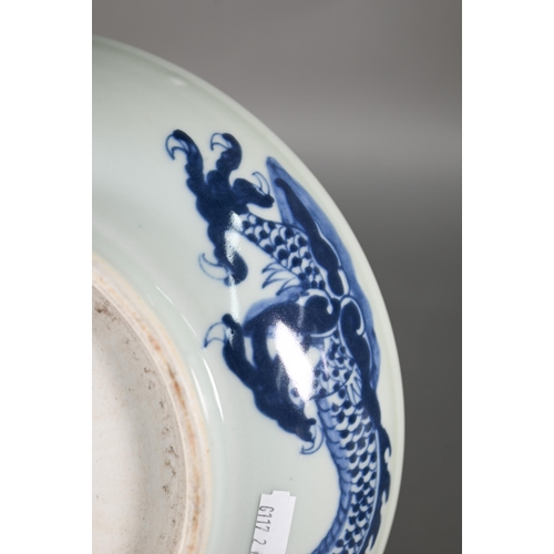 358 - A Chinese transitional style blue and white dragon charger in the mid 17th century manner, painted i... 