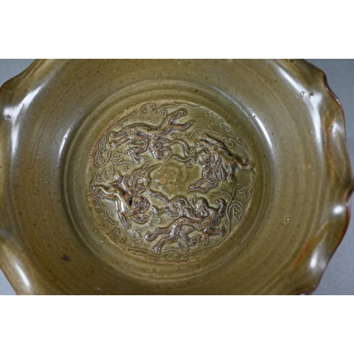 368 - A Chinese Song style stemmed fruit dish with olive green glaze and relief mythical beast decoration,... 