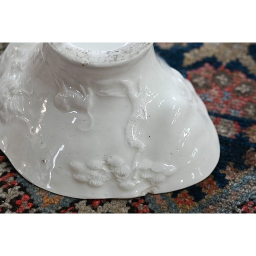 392 - A 18th century Chinese Dehua porcelain rhinoceros horn-form libation cup, moulded relief decoration ... 