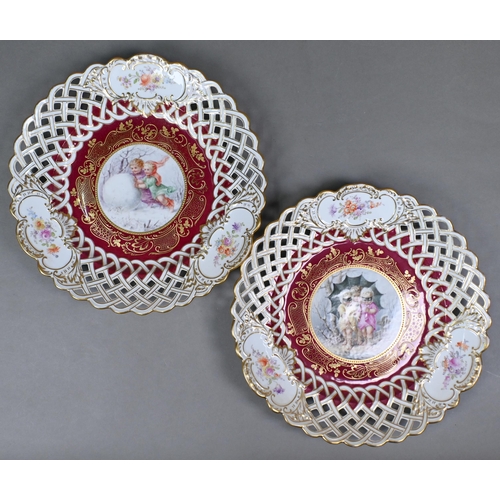 493 - A matched set of four Meissen/Dresden cabinet plates painted with children - three in winter setting... 