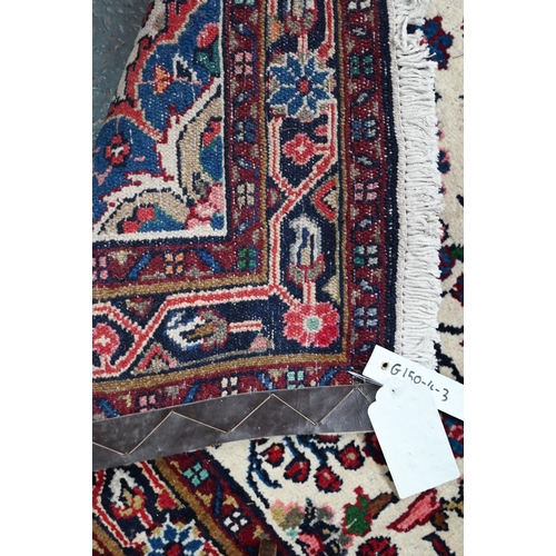 758 - A contemporary North West Persian Sarouk runner, the camel ground with floral designs, 400 cm x 80 c... 