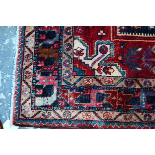 764 - A contemporary North West Persian Nahawand rug, centred by a red ground medallion, 230 cm x 135 cm