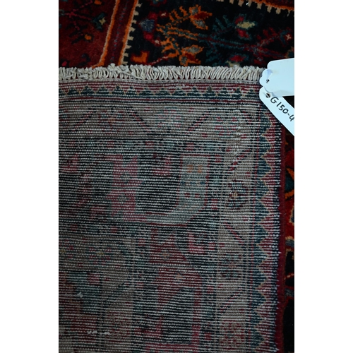 764 - A contemporary North West Persian Nahawand rug, centred by a red ground medallion, 230 cm x 135 cm