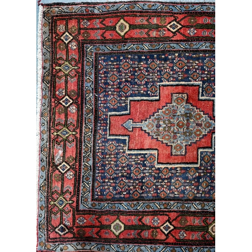 770 - A contemporary North West Persian Senneh runner, with lozenge pole design on red ground, 382 cm x 93... 