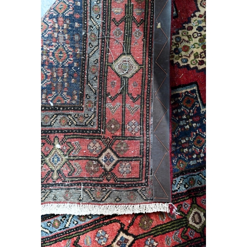 770 - A contemporary North West Persian Senneh runner, with lozenge pole design on red ground, 382 cm x 93... 