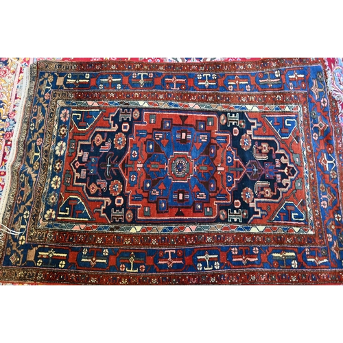 772 - A Persian Bakhtiari rug, probably Armenian 1930s, large central medallion and smaller scattered rose... 