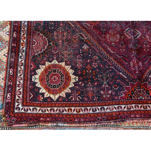 788 - A South West Persian Qashqai carpet, red ground with scattered rosettes within narrow borders,  312 ... 