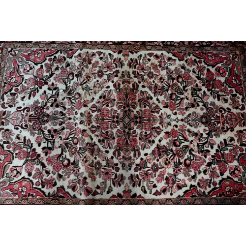 791 - A North West Persian Lilihan rug, traditional centre floral medallion design on soft rose ground, 21... 