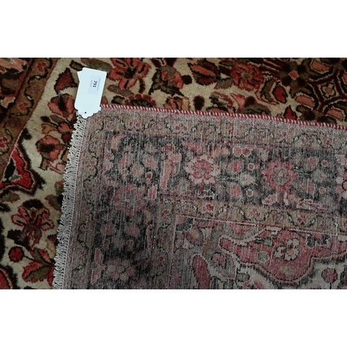 791 - A North West Persian Lilihan rug, traditional centre floral medallion design on soft rose ground, 21... 