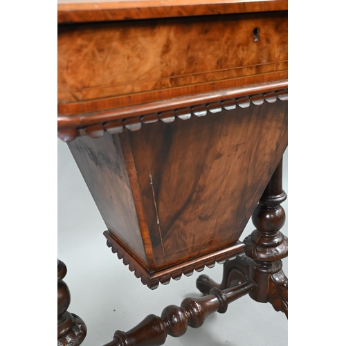 815 - A Victorian walnut veneered work table, the quarter veneered hinged top enclosing a fitted interior ... 